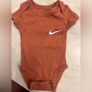 Nike Terracotta Baby Onesie